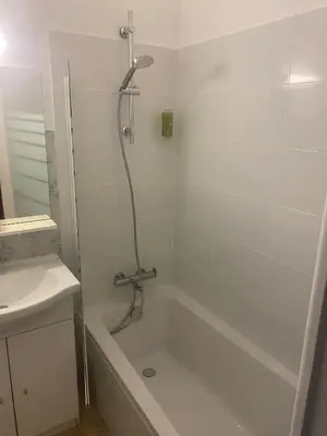 a bathroom with a bath tub and a shower at Studio 29 Nice Magnan in Nice
