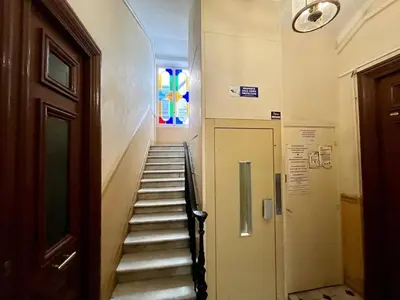 a stairway in a building with a stained glass window at Nice Signature Assalit Studio in Nice