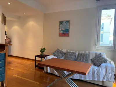 a living room with a couch and a table at Nice Signature Halévy in Nice
