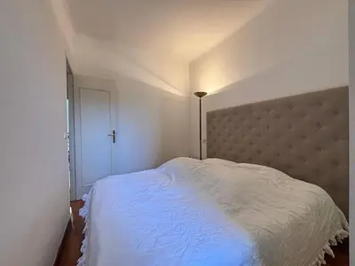 a bedroom with a large white bed with a headboard at Nice Signature Halévy in Nice