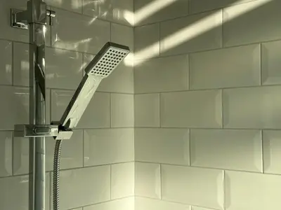 a shower with a shower head in a bathroom at Panoramic Sea View Studio in Cagnes-sur-Mer
