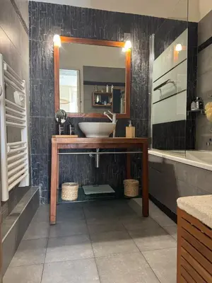 a bathroom with a sink and a mirror at Port de nice in Nice