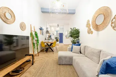 a living room with a couch and a table at Boho Chic Apartment in Old Town in Nice