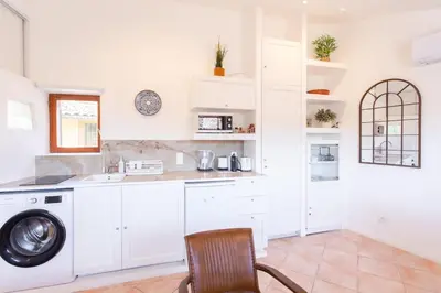 a kitchen with white cabinets and a washing machine at #5 Eagle Nest 5mins walk of the Sea AC Wifi Old town in Nice