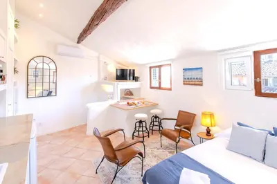 a living room with a bed and a kitchen at #5 Eagle Nest 5mins walk of the Sea AC Wifi Old town in Nice