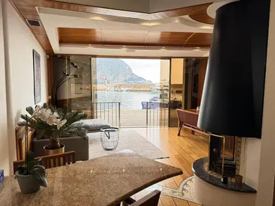 a living room with a view of the water at Seaside Serenity, Portside Apartment in Èze