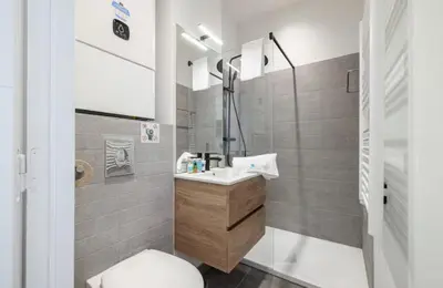 a bathroom with a sink and a toilet in it at Cozy studio near the sea in Nice