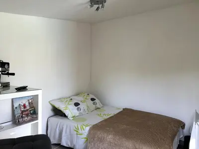 a small bedroom with a bed with a pillow at Cabana 12 m2 in Nice
