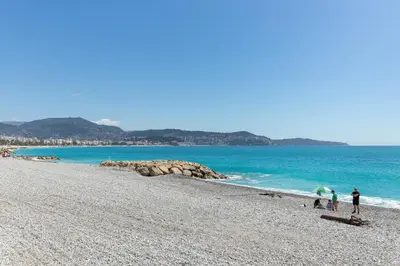a group of people standing on a beach at Happyfew La Suite Del Sol in Nice