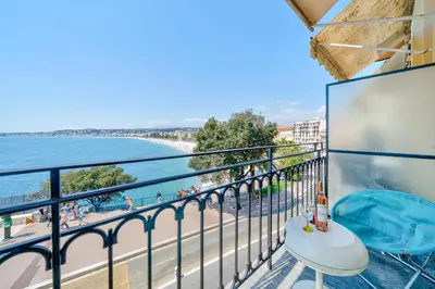 a balcony with a view of the beach and the ocean at Panoramic Sea View - Promenade des Anglais in Nice