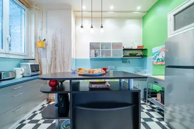 a kitchen with a table with a plate of food on it at Panoramic Sea View - Promenade des Anglais in Nice