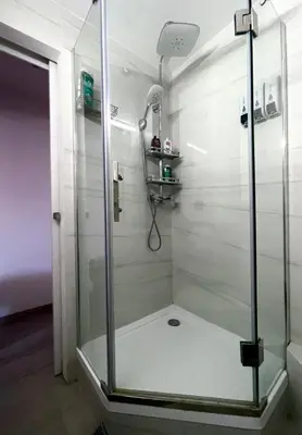 a shower with a glass door in a bathroom at Petit Bijou niçois in Nice