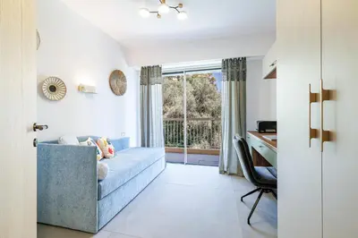a living room with a blue couch and a window at MY CASA - GAIRAUT - 5 rooms - Terrasse in Nice
