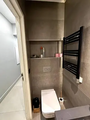 a small bathroom with a toilet and a shelf at Splendide Nice Centre Clim in Nice