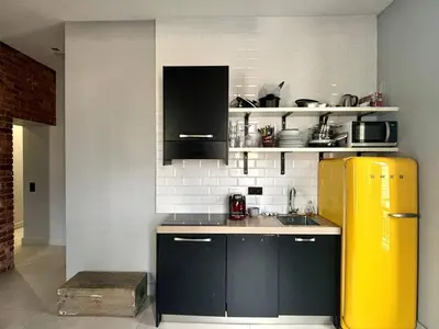 a kitchen with a yellow refrigerator in a room at Splendide Nice Centre Clim in Nice