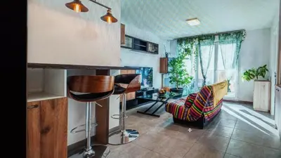 a living room with a couch and a table at Nice barelli in Nice