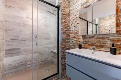 a bathroom with a sink and a glass shower at Nice barelli in Nice
