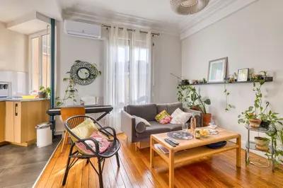 a living room with a couch and a table at Cocon D'Azur - 5min from the beach - Happy Rentals in Nice