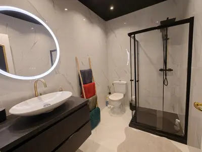 a bathroom with a sink and a glass shower at Spacious NEW Apt near Promenade up to 6 with AC in Nice