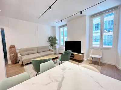 a living room with a couch and a tv at RF104 - Charmant 3P à nice près du Port in Nice