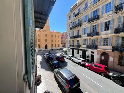 a view from a window of a street with parked cars at RF104 - Charmant 3P à nice près du Port in Nice