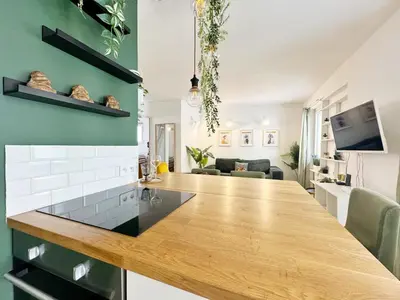 a kitchen with a wooden counter top in a room at RF107 - Moderne 3P Nice Port Place du Pin in Nice
