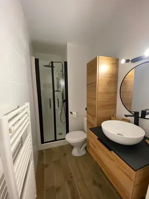 a white bathroom with a sink and a toilet at Studio cosy proche de la mer in Nice