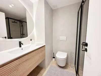 a bathroom with a sink and a toilet and a mirror at RF112 - T3 Lumineux à deux pas du port in Nice