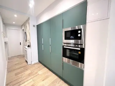 a kitchen with a stove and a microwave at RF101- Magnifique 3 pièces centre Nice in Nice