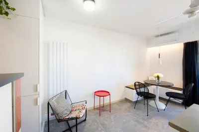 a living room with a staircase leading to a living room at OFF