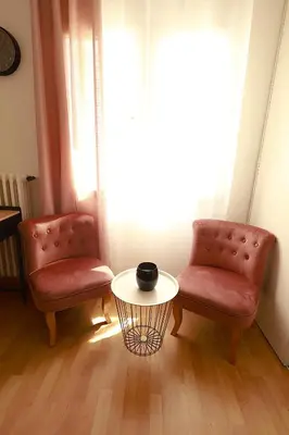 two chairs and a table in front of a window at AERO Nice in Nice