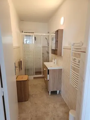 a bathroom with a sink and a shower in it at Superbe appartement vue mer in Cagnes-sur-Mer