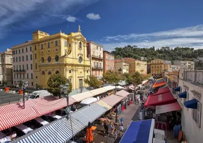 an overview of a city street with cafes and restaurants at Charmant T2 proche tramway et plages in Nice
