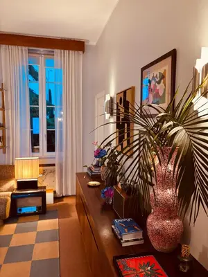 a living room with a couch and a table with a plant at Elegant apartment, Cap de Nice in Nice