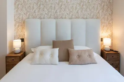 a bedroom with a white bed with two pillows at #52 Etoile Suite ,Central, Balcony, AC-5 min P Massena in Nice