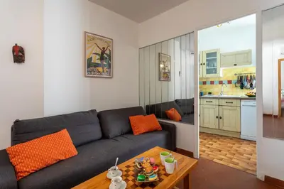 a living room with a couch and a table at VUE ROSSETTI AP4465 by Riviera Holiday Homes in Nice