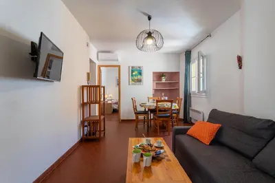 a living room with a couch and a table at VUE ROSSETTI AP4465 by Riviera Holiday Homes in Nice