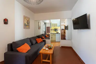 a living room with a couch and a table at VUE ROSSETTI AP4465 by Riviera Holiday Homes in Nice