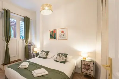 a bedroom with a bed with two towels on it at #55 Sun terrace AC & Wifi 10mins walk to Sea & oldtown in Nice