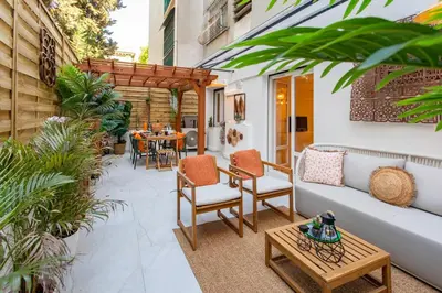 a patio with a couch and chairs and a table at #55 Sun terrace AC & Wifi 10mins walk to Sea & oldtown in Nice