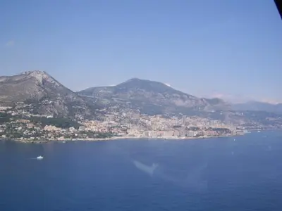 a large body of water with a city and mountains at Long stay in Old town of Nice, Castle Hill in Nice