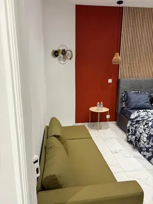 a living room with a couch and a bed at Beautiful and super central in Nice