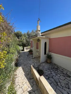 a small building with a small tower on top of it at Seaside Jungle Retreat in Nice
