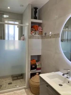 a bathroom with a sink and a mirror at Chambre de charme in Nice