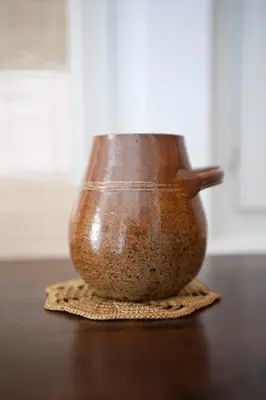 a brown vase sitting on top of a table at Cap de Nice in Nice