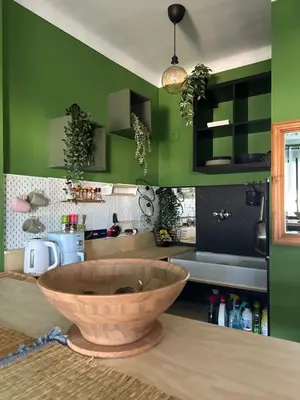 a kitchen with a large wooden bowl on a counter at A Studio at Nice Beach in Nice