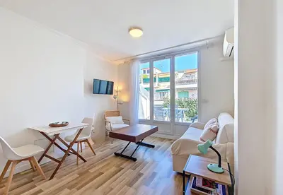 a living room with a couch and a table at Nestor&Jeeves - CASA SOLANA - Terrace - Central in Nice