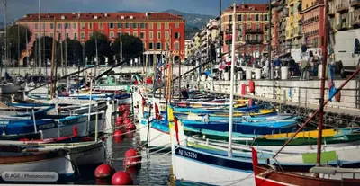 a bunch of boats docked in a harbor with buildings at A room in Nice Beach in Nice