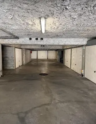 an empty parking garage with a large concrete floor at Spacious, quiet apartment in Nice