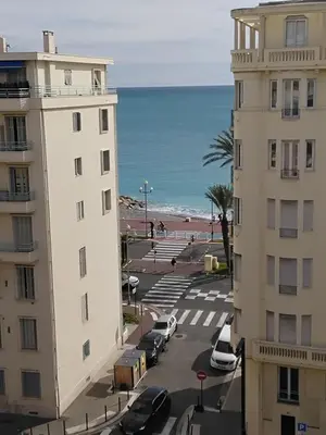 a view of the beach from the apartment building at Près de la promenade in Nice